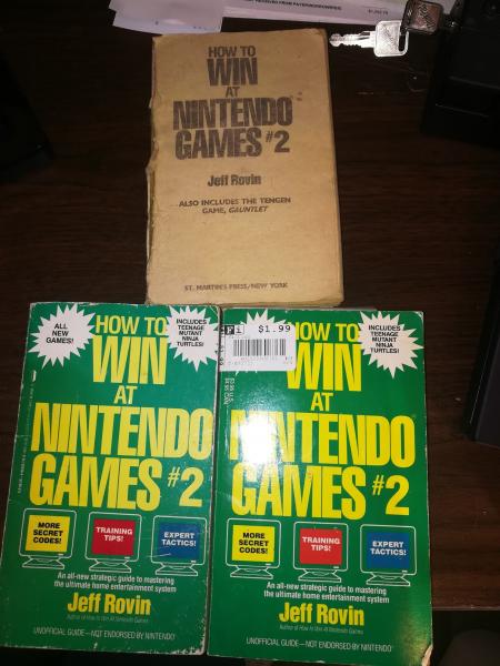 three copies of How To Win At Nintendo Games 2